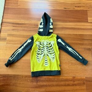 Hard to find Rags to Raches Skeleton Hoodie
Glows in the dark
